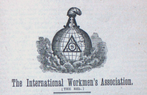 Logo with a glove topped by a mason's toop and a phyrgian cap, with International Workmen's Association [The Red]' below